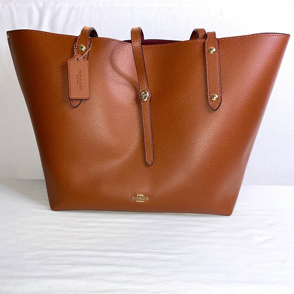 Coach Brown Tote Bag with Leather Straps and Structured Design